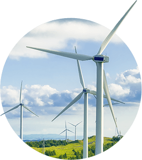 A group of wind turbines on the side of a hill.